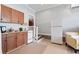 Kitchen with wood cabinets, white appliances, and steps leading to an adjacent room at 129 Saluda Dr, Moncks Corner, SC 29461