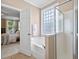 Bright main bathroom featuring a soaking tub, separate shower, and tile floors at 129 Saluda Dr, Moncks Corner, SC 29461