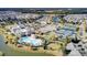 Stunning aerial view of community amenities, including a large pool, tennis courts, clubhouse, and well-maintained landscaping at 129 Schooner Bend Ave, Summerville, SC 29486