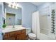 Bathroom featuring a single sink vanity, toilet, and shower with curtain at 129 Schooner Bend Ave, Summerville, SC 29486