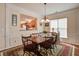 Dining room features hardwood floors, a view into the kitchen, and decorative lighting at 129 Schooner Bend Ave, Summerville, SC 29486