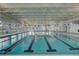 Bright indoor swimming pool with natural light, multiple lanes and high ceilings at 129 Schooner Bend Ave, Summerville, SC 29486