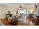 Open-concept living room featuring hardwood floors, comfortable seating, and lots of natural light at 129 Schooner Bend Ave, Summerville, SC 29486
