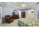 Main bedroom features crown molding, a ceiling fan, and a large dresser with television at 129 Schooner Bend Ave, Summerville, SC 29486