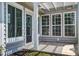 Back patio featuring a pergola and multiple windows at 129 Schooner Bend Ave, Summerville, SC 29486