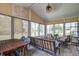 Relaxing sunroom featuring comfortable seating and view of the yard at 129 Schooner Bend Ave, Summerville, SC 29486