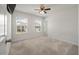 Light-filled bedroom with a ceiling fan and two windows, offering beautiful views of the surrounding neighborhood at 1311 Berry Grove Dr, Summerville, SC 29485
