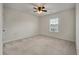 Bright bedroom with a ceiling fan and window, providing a comfortable and inviting space at 1311 Berry Grove Dr, Summerville, SC 29485