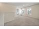 Bonus room featuring neutral walls and carpet, adjacent to a laundry room at 1311 Berry Grove Dr, Summerville, SC 29485