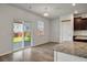 Bright kitchen with a granite topped island and sliding glass doors out to the backyard at 1311 Berry Grove Dr, Summerville, SC 29485