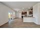 Kitchen and breakfast nook area with wood-look flooring and sliding glass doors at 1311 Berry Grove Dr, Summerville, SC 29485
