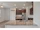 Close-up shot of the island in the kitchen with granite countertop at 1311 Berry Grove Dr, Summerville, SC 29485