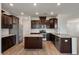 Bright kitchen featuring stainless steel appliances, granite countertops, and dark cabinets at 1311 Berry Grove Dr, Summerville, SC 29485