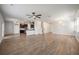 Open-concept living room featuring wood-look flooring and plenty of natural light at 1311 Berry Grove Dr, Summerville, SC 29485