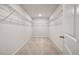 Spacious walk-in closet featuring carpet floors and wire shelving offering ample storage solutions at 1311 Berry Grove Dr, Summerville, SC 29485