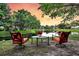 Relaxing backyard seating area with lake view, perfect for outdoor enjoyment and peaceful contemplation at 1311 Royal Links Dr, Mount Pleasant, SC 29466