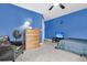 Bright bedroom with blue walls, ceiling fan, and wood dresser at 1311 Royal Links Dr, Mount Pleasant, SC 29466