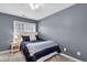 Cozy bedroom features neutral walls, carpet, and window providing natural light with a comfortable bed and nightstand at 1311 Royal Links Dr, Mount Pleasant, SC 29466