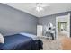 Bedroom with light grey walls and plush carpet featuring a vanity table and chair, and doorway into another room at 1311 Royal Links Dr, Mount Pleasant, SC 29466