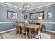 Well-lit dining room with seating for six, stylish decor and a neutral-toned rug at 1311 Royal Links Dr, Mount Pleasant, SC 29466
