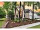 Charming two-story home with a well-manicured lawn, beautiful flower beds, and inviting curb appeal at 1311 Royal Links Dr, Mount Pleasant, SC 29466