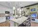 Open kitchen featuring a large island with granite countertops and seating overlooking the living area at 1311 Royal Links Dr, Mount Pleasant, SC 29466