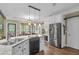 Bright eat-in kitchen with white cabinets, stainless steel appliances, and granite countertops at 1311 Royal Links Dr, Mount Pleasant, SC 29466