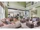 Open concept living room showcasing a kitchen, sitting area, and comfortable leather seating at 1311 Royal Links Dr, Mount Pleasant, SC 29466