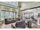 Spacious living room highlighting multiple windows, vaulted ceiling and comfortable seating area at 1311 Royal Links Dr, Mount Pleasant, SC 29466