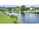 Scenic pond with lush green shoreline and serene water reflecting surrounding trees and homes at 1311 Royal Links Dr, Mount Pleasant, SC 29466
