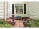 Cozy front porch features a bench with decorative pillows and charming seasonal decor at 1311 Royal Links Dr, Mount Pleasant, SC 29466