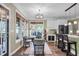 Open-concept sitting area with views to the wet bar and kitchen with barstool seating at 1311 Royal Links Dr, Mount Pleasant, SC 29466
