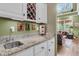Wet bar featuring granite counters, wine rack and view into the adjacent sitting room at 1311 Royal Links Dr, Mount Pleasant, SC 29466