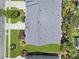A top-down view of a home's roof and landscaped grounds, highlighting the manicured lawn and garden at 132 Fresh Meadow Ln, Mount Pleasant, SC 29466