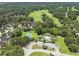 An aerial view displaying a community pool, tennis court, surrounding homes, and lush green space at 132 Fresh Meadow Ln, Mount Pleasant, SC 29466