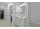 Bathroom with vanity and a glimpse into a walk-in closet visible through the doorway at 132 Fresh Meadow Ln, Mount Pleasant, SC 29466