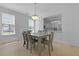 Bright dining room with chandelier and a view of the kitchen at 132 Fresh Meadow Ln, Mount Pleasant, SC 29466