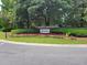 An entrance to Dunes West surrounded by colorful flowers and lush green landscaping at 132 Fresh Meadow Ln, Mount Pleasant, SC 29466