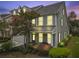 Charming two-story home with a well-manicured lawn, garden, and inviting covered front porch at 132 Fresh Meadow Ln, Mount Pleasant, SC 29466