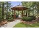 Picturesque gazebo nestled in a serene setting with lush landscaping, creating a tranquil outdoor retreat at 132 Fresh Meadow Ln, Mount Pleasant, SC 29466