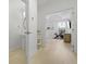 Hallway view of half bath, leading into bright bedroom and workout space at 132 Fresh Meadow Ln, Mount Pleasant, SC 29466