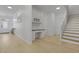 Hallway with a built-in desk nook and access to the staircase and front door at 132 Fresh Meadow Ln, Mount Pleasant, SC 29466