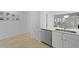 Kitchen sink with stainless steel dishwasher and hardwood floors at 132 Fresh Meadow Ln, Mount Pleasant, SC 29466