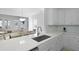 Kitchen sink with quartz countertop overlooking dining area at 132 Fresh Meadow Ln, Mount Pleasant, SC 29466