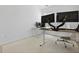 Well-lit office with dual monitors, white chair, and a stylish geometric patterned rug at 132 Fresh Meadow Ln, Mount Pleasant, SC 29466