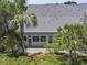 Home's rear exterior featuring a patio area and lush landscaping at 132 Fresh Meadow Ln, Mount Pleasant, SC 29466
