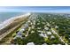 Expansive aerial view of a coastal neighborhood with stunning beach access and lush greenery at 14 55Th Ave, Isle of Palms, SC 29451