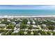 Beautiful oceanfront home nestled amongst lush greenery with direct beach access at 14 55Th Ave, Isle of Palms, SC 29451