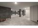 Large unfinished basement with concrete flooring, exposed brick, and white walls at 14 55Th Ave, Isle of Palms, SC 29451