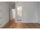 Bright bathroom with hardwood floors, white trim, and decorative black and white tiled floor at 14 55Th Ave, Isle of Palms, SC 29451